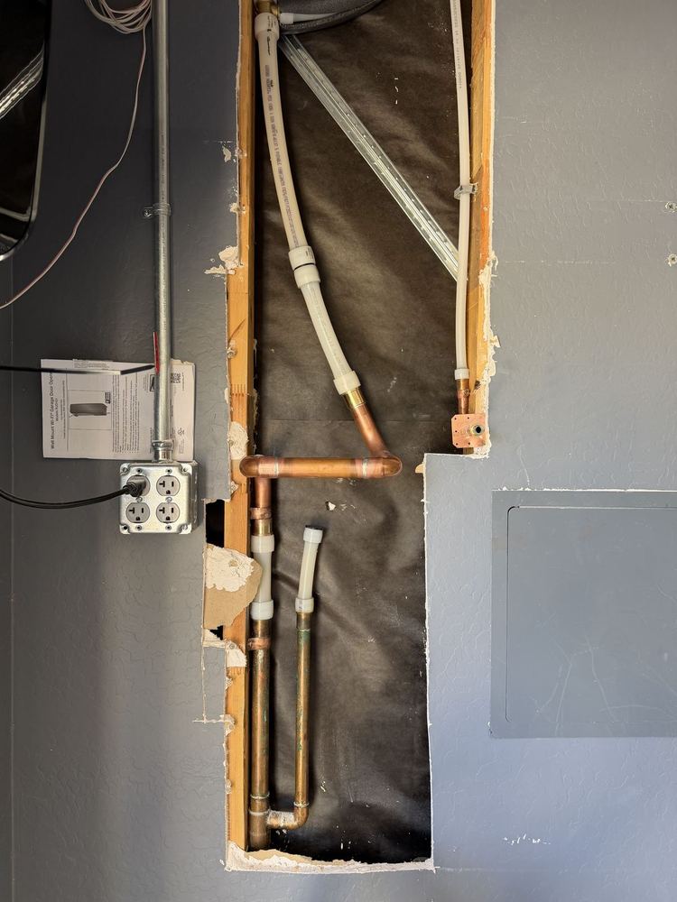 Water line and copper piping installation in progress