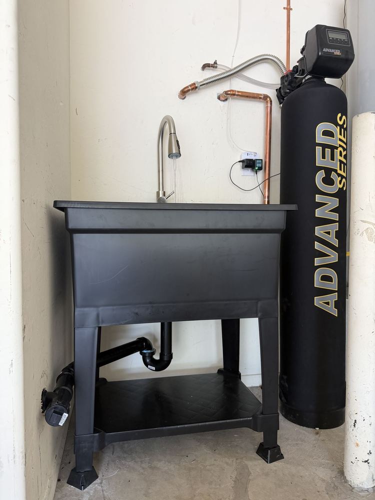 Water softener installation with utility sink setup